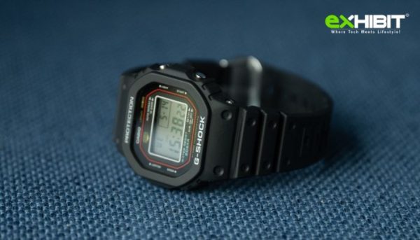 Casio G-SHOCK DW-5000R close-up showing retro octagonal face, black resin case, and colorful accents.