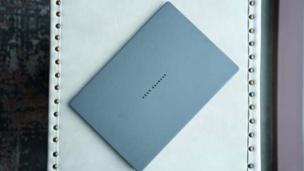 Asus Zenbook A14 laptop showcasing its sleek Ceraluminum chassis and matte grey finish.