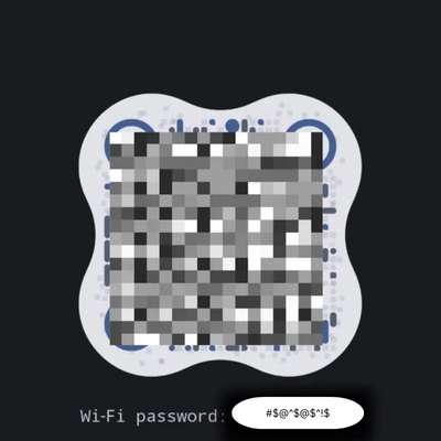 Android phone showing a QR code and the Wi-Fi password after tapping 'Share'.