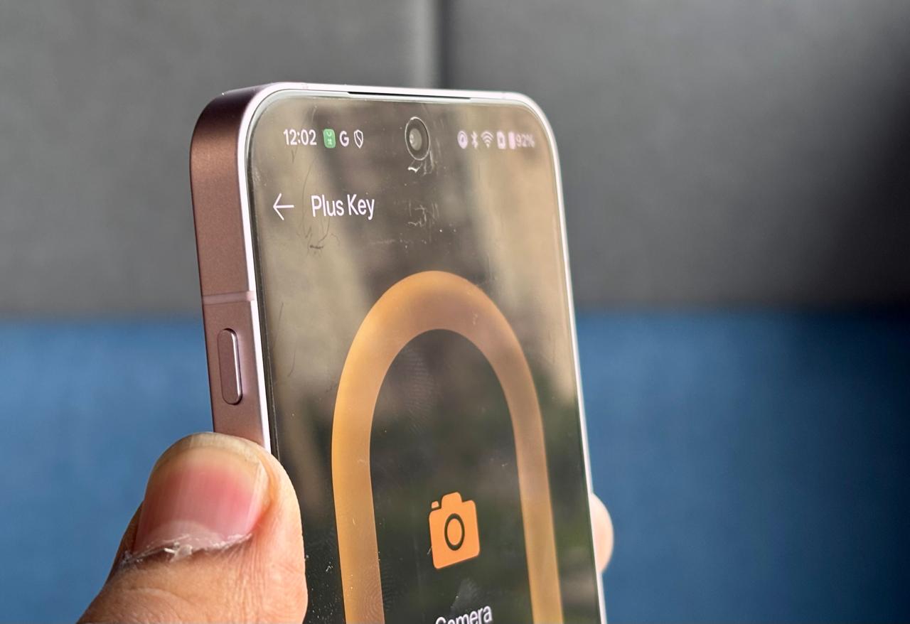 Close-up of the new customizable Plus Key on the OnePlus 13s side panel