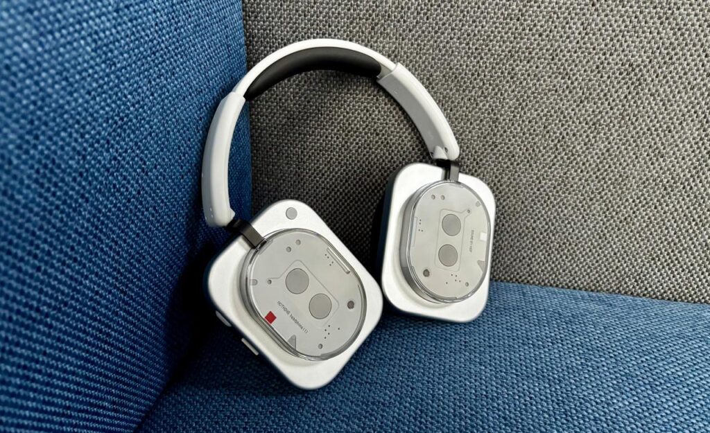 Nothing Headphone (1) in black with transparent earcups and retro-futuristic design, placed on a white surface.