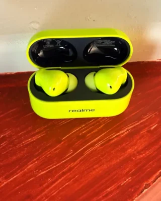 Top view of the Realme Buds T200, showcasing the short stem design and silicone ear tips for comfort and grip.